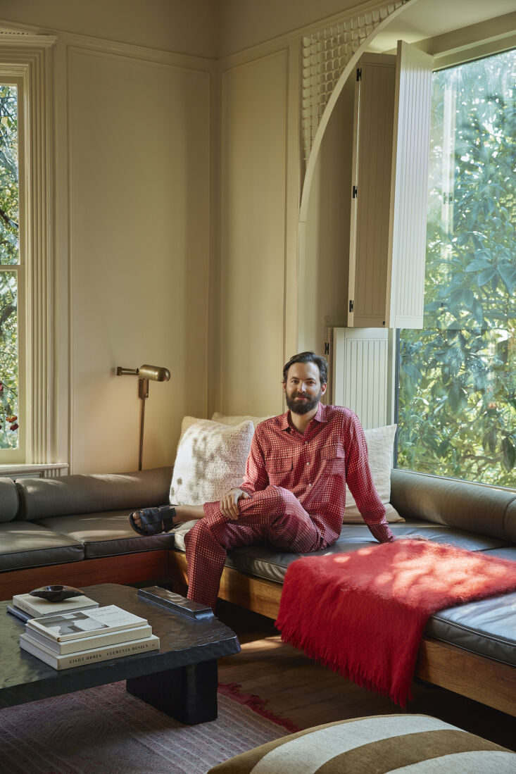 Architect Pat Bernatz and his family sitting in their restored living room.