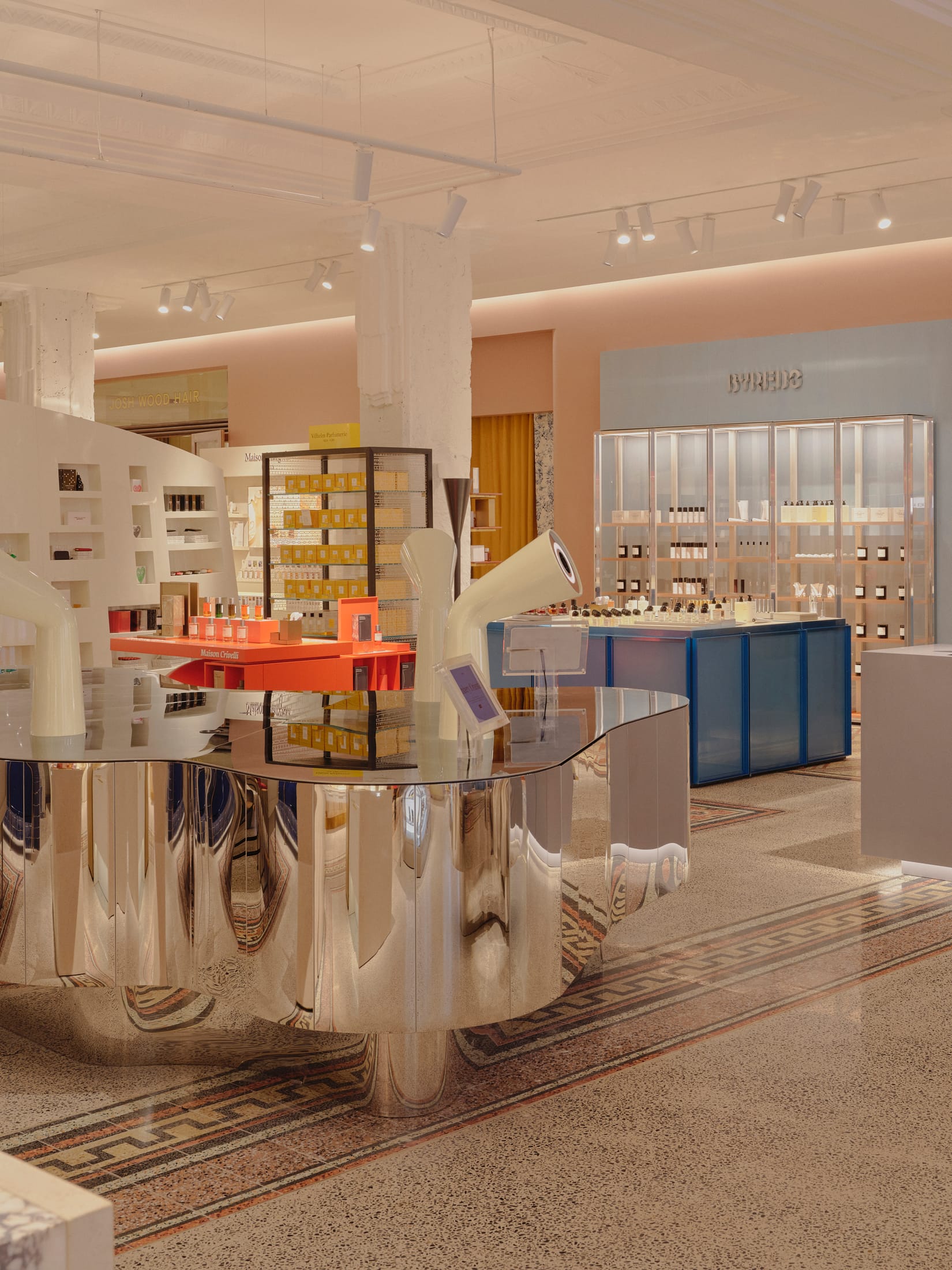 Close-up of restored rose-mauve faience tiling on an interior pillar.