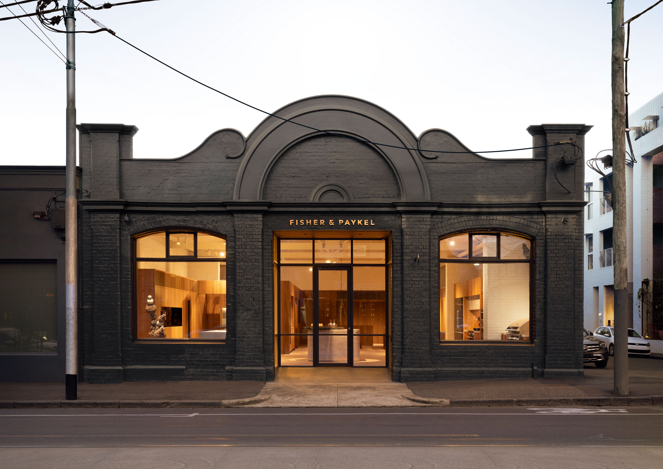 A wide-angle view of the Fisher & Paykel Melbourne Experience Centre interior within the restored 1920s garage.