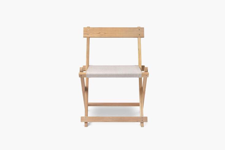 The Børge Mogensen Deck Folding Dining Chair in a folded and upright position.