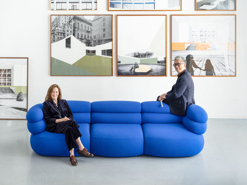 Sharon Johnston and Mark Lee sitting on opposite ends of the blue Biboni sofa.