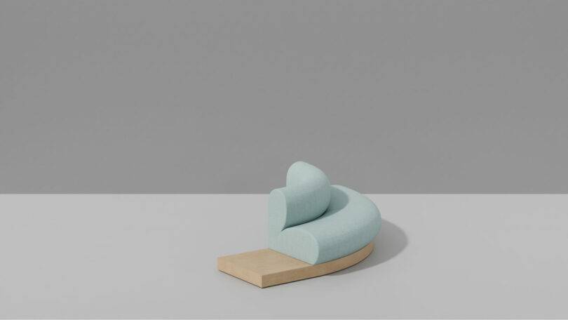 Large light blue curved modular sofa with a wooden base.