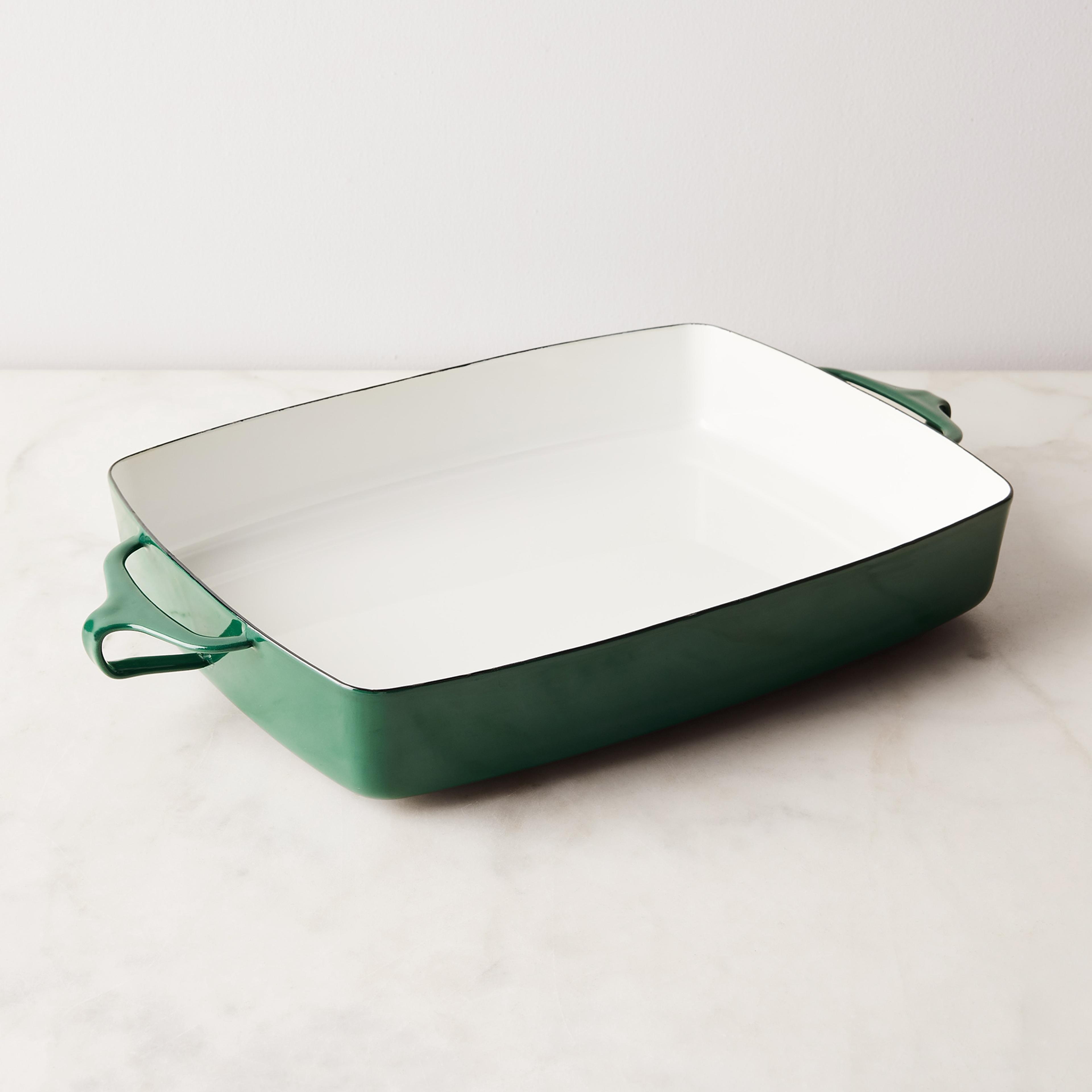 A green Dansk Kobenstyle baker sitting on a wooden table.