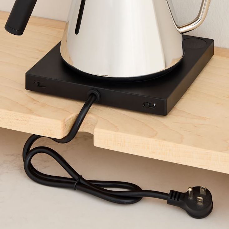 Comparison of maple and walnut wood finishes for kitchen appliance cord boxes.