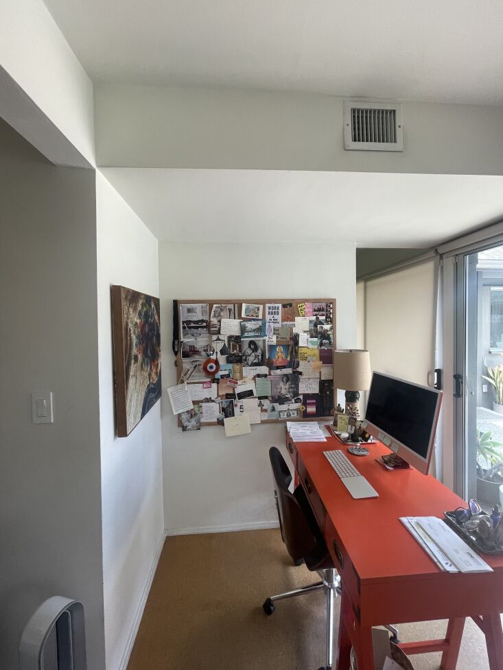 The original dated dressing area with a long white lacquered desk before the renovation.