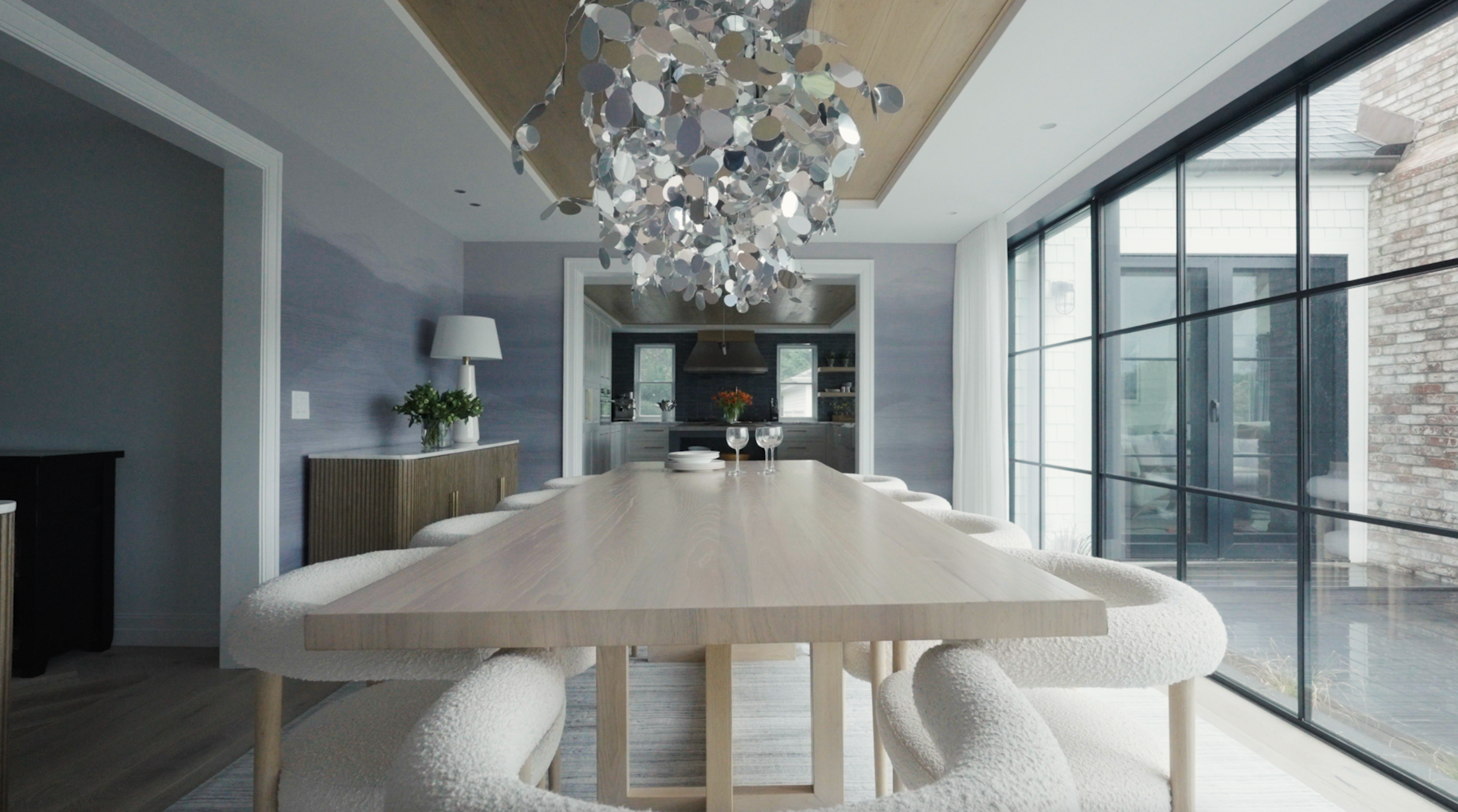 A dining area designed with clean lines and textures suitable for multi-purpose use.