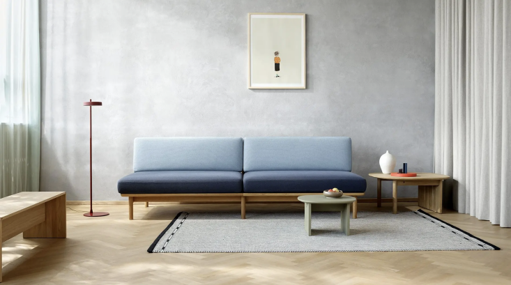 Detailed view of the Spoke Sofa's wooden spindle back and minimalist frame.