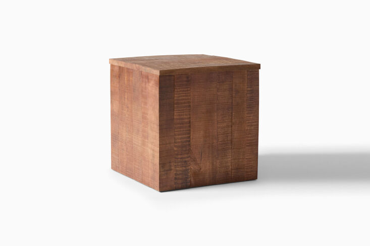 A dark, hand-crafted mango wood side table with a circular lid.