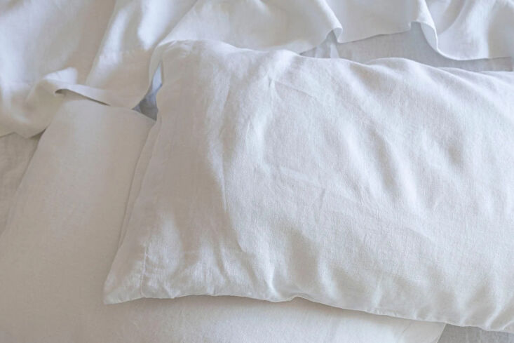 A close-up of thick, high-quality linen sheets showing the weave detail.