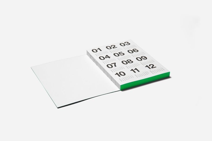 The Marjolein Delhaas Basic Planner in black and gray-beige showing its lay-flat binding.