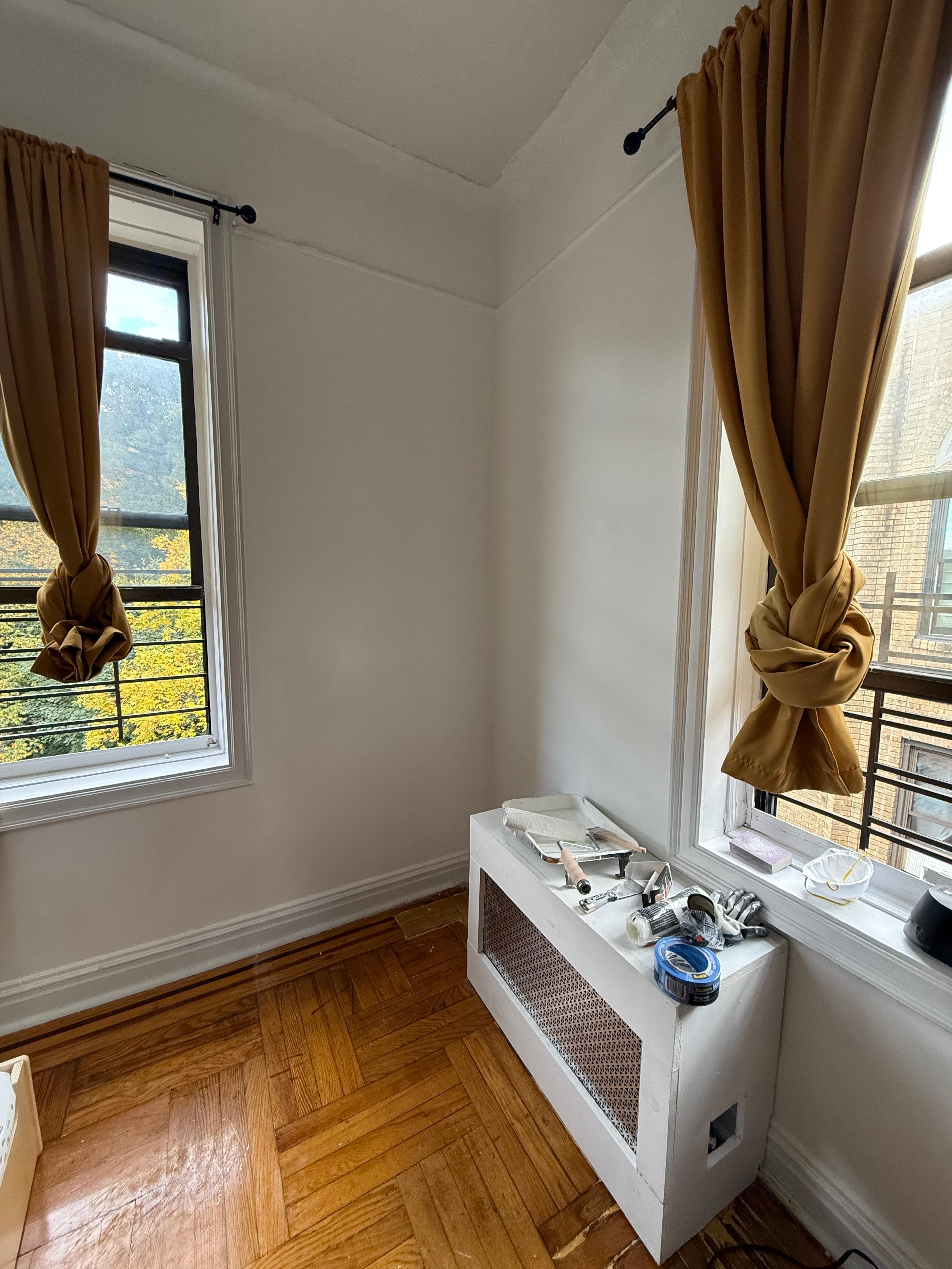A room corner showing how the wall-mounted art station leaves the floor area clear.