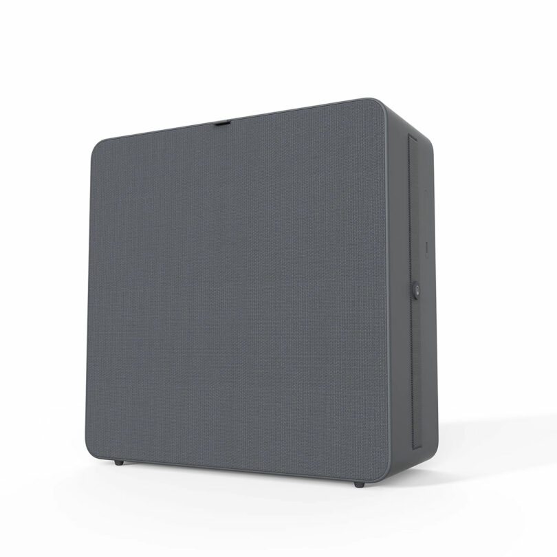 Close-up of a rectangular gray air purifier with a woven fabric front.