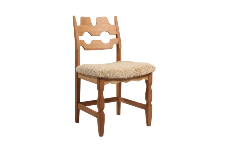 Danish modern 'Razorblade' chair with a distinctive curved wooden backrest.