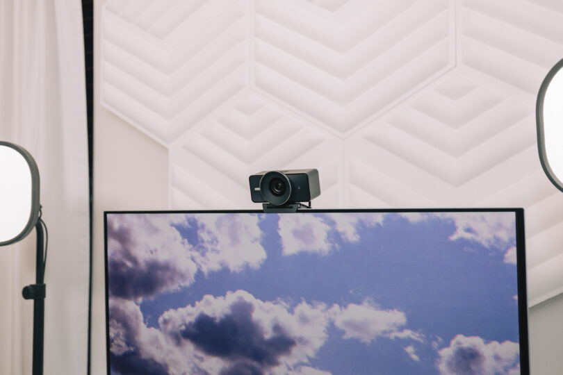 Elgato webcam setup with softbox studio lights and acoustic wall panels.