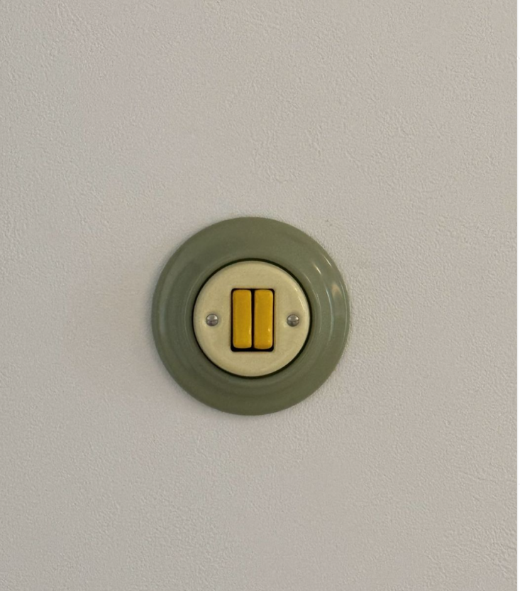 A triple Roo switch featuring green and yellow porcelain finishes.