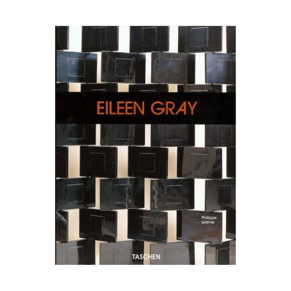 Eileen Gray’s adjustable E-1027 circular glass and chrome side table.