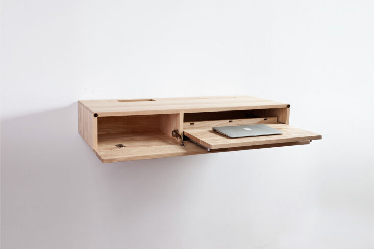 The Ledge Wall-Mounted Desk, a simple wooden floating surface without legs.