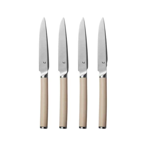 Extra virgin olive oil being poured over a seasoned fish fillet.