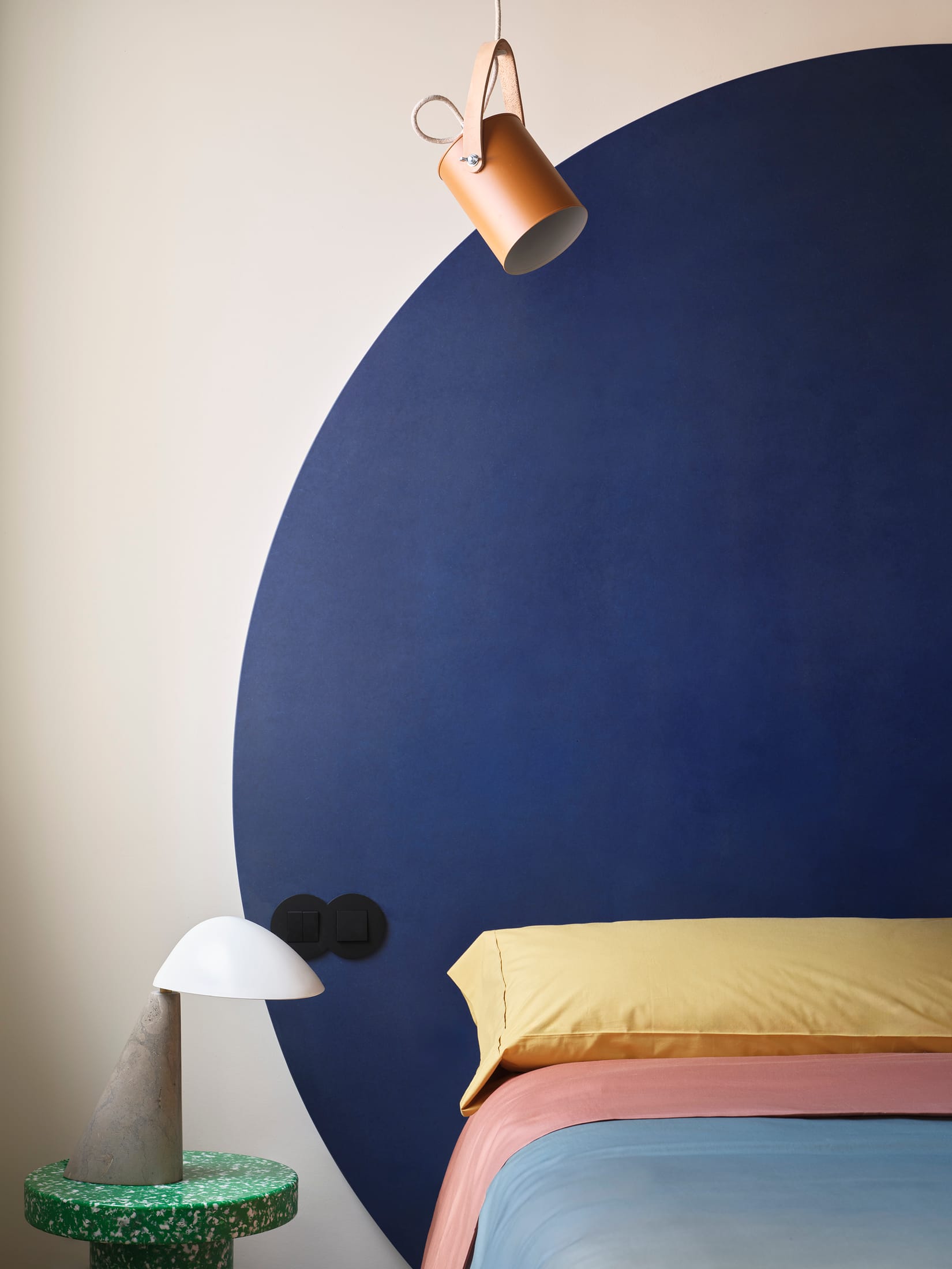 Detail of the sky-blue steel staircase and thin structural members.