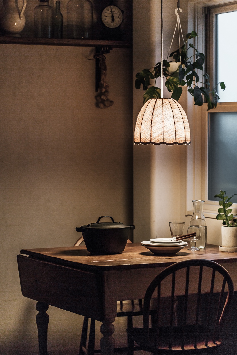 Close-up of a linen Amande pendant light showing the weave and soft light transparency.