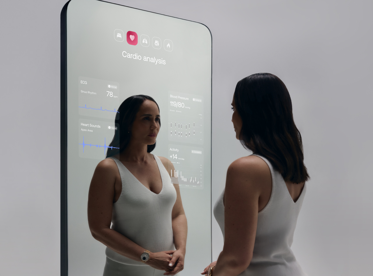 A digital display on a smart mirror showing various connected health metrics like heart rate and body composition unified in one interface.