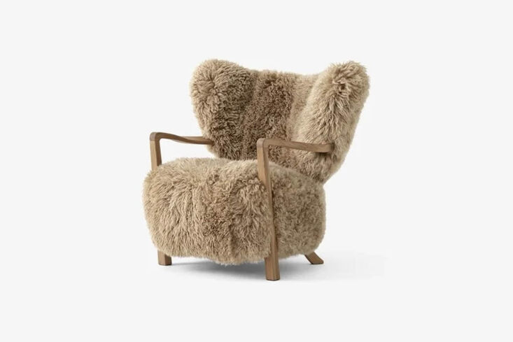 Wulff Lounge Chair upholstered in honey sheepskin with a solid oak frame.