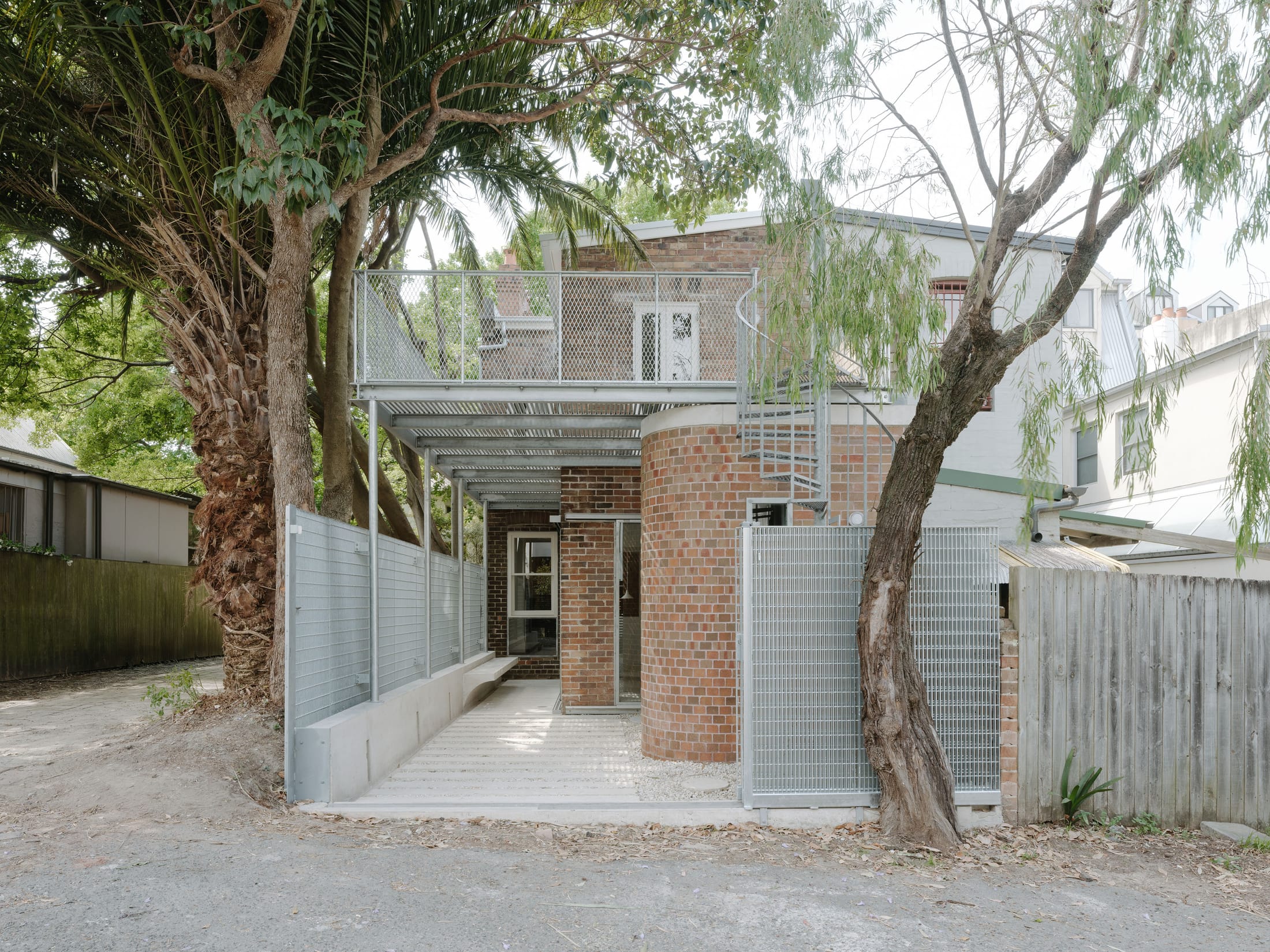 Detailed view of galvanised steel mesh providing privacy while allowing air flow.