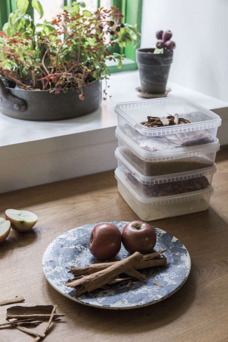 Clear, stackable plastic storage containers used for organizing pantry ingredients.