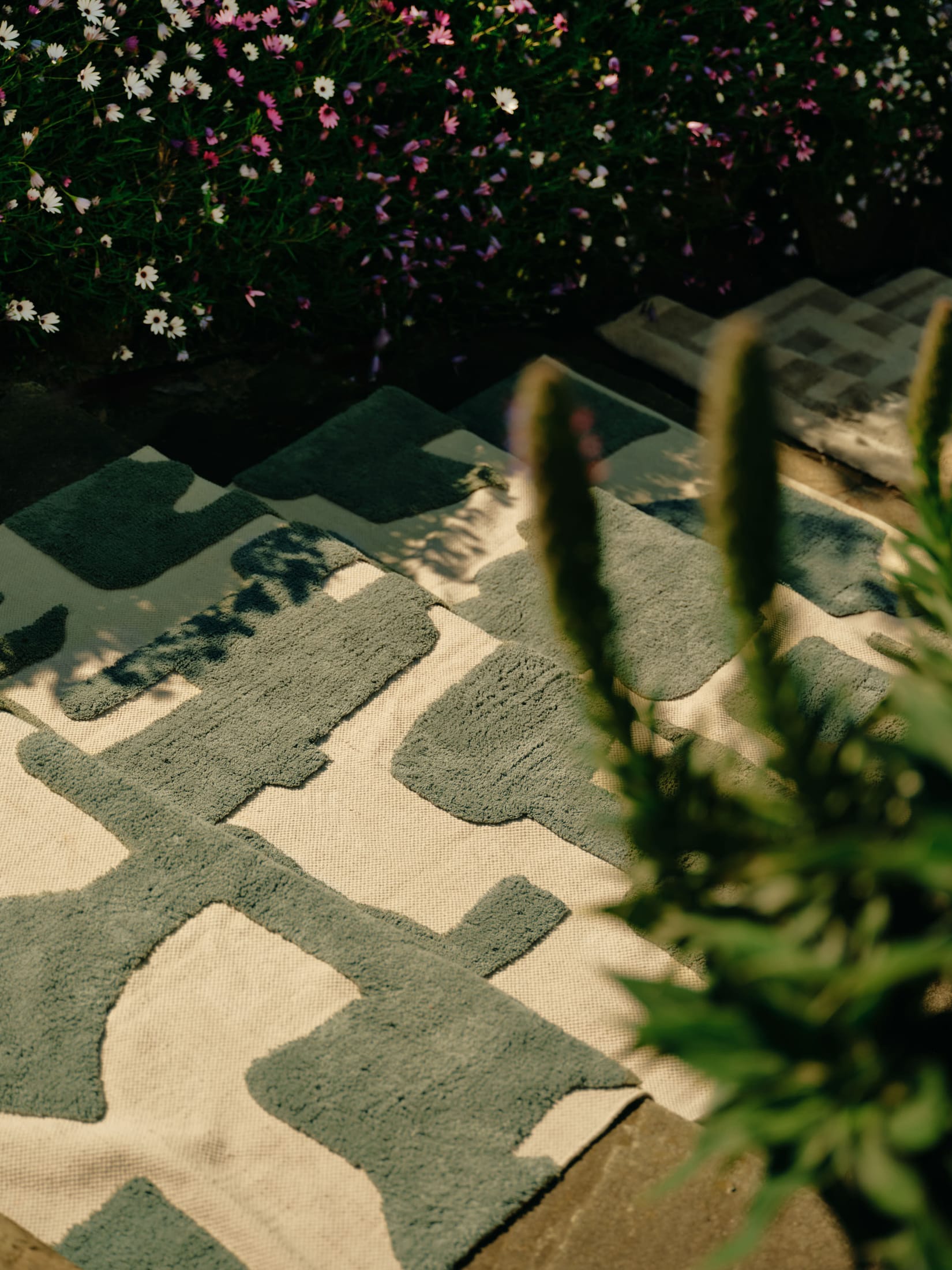 Close-up texture of the Tarkine Green rug showing the organic cotton and wool weave.