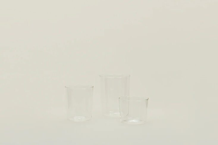 A colorful set of Hawkins New York Essential Glassware in different shades.