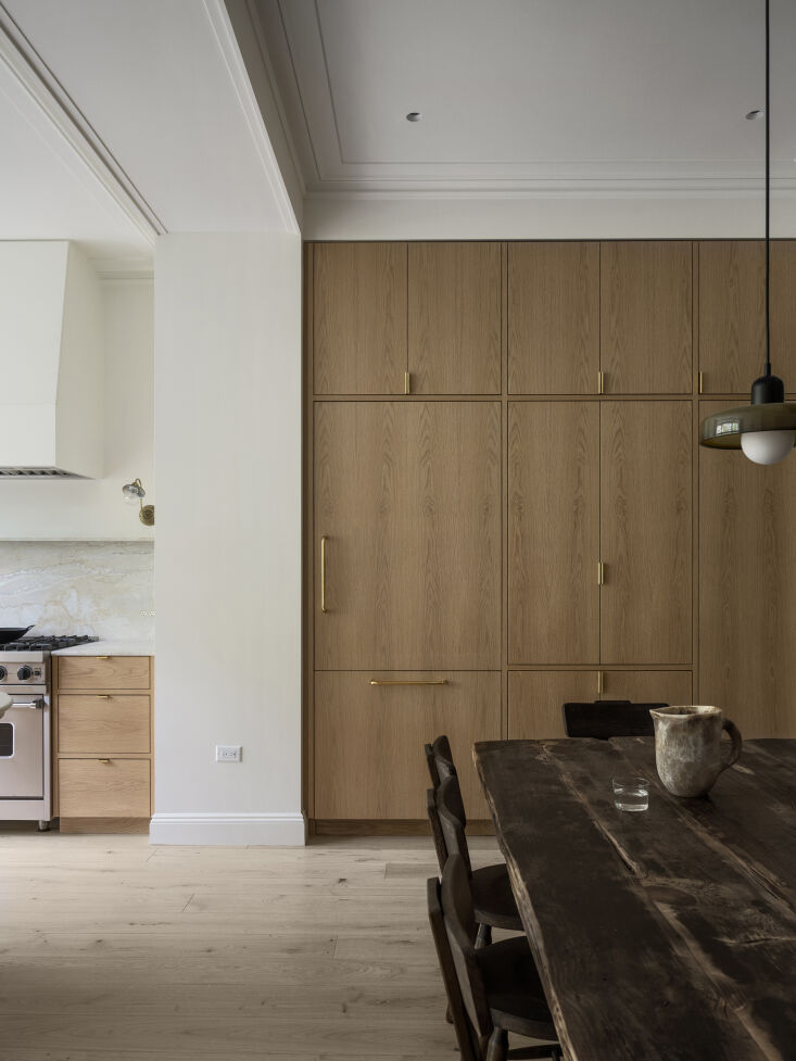 Modern kitchen on the parlor level with custom plain-sawn oak cabinetry and integrated built-ins.