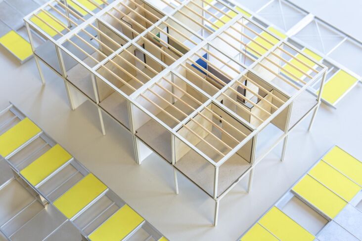 A mockup or diagram showing the 10x10 horizontal modular grid system of the building.