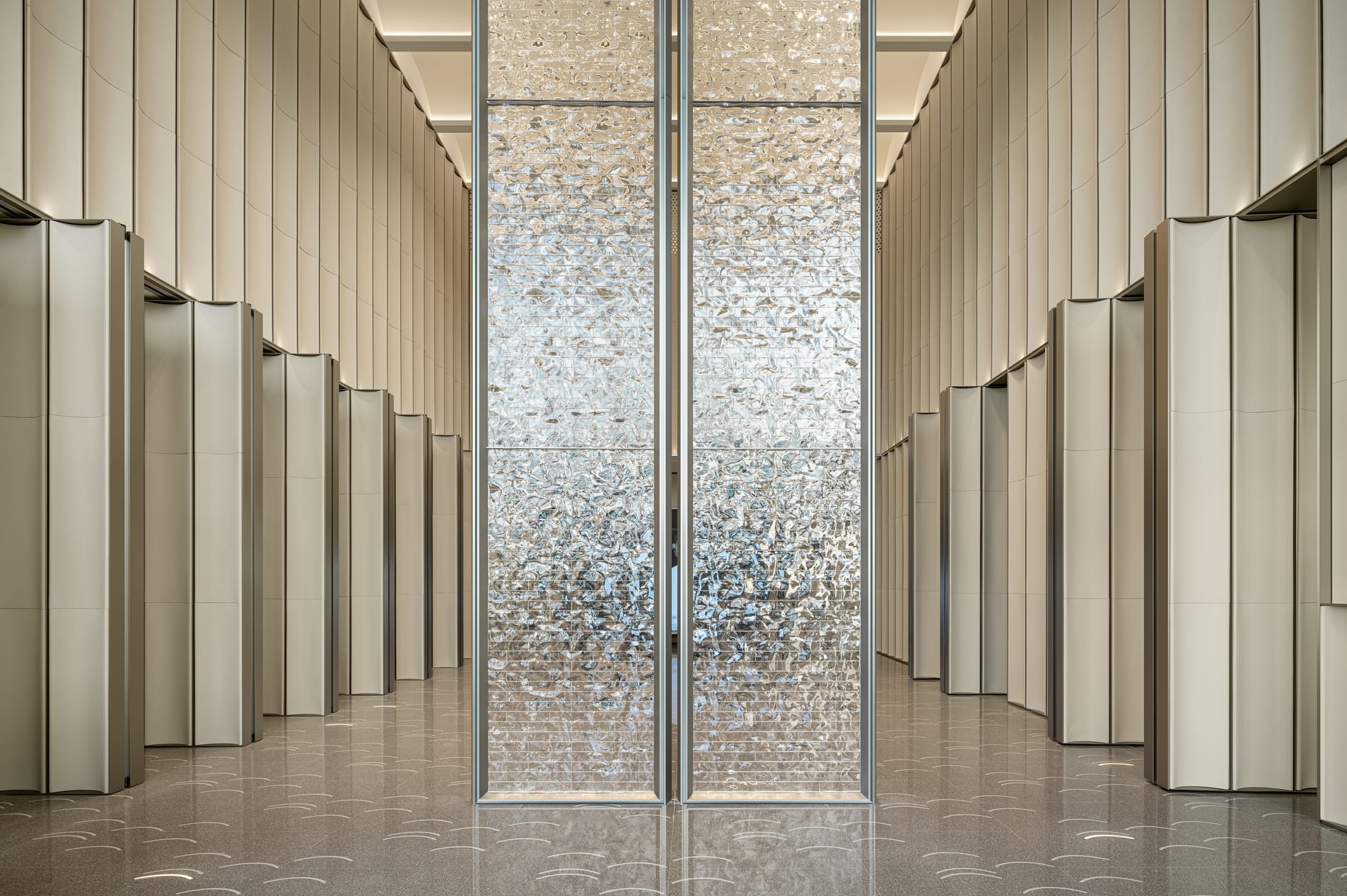 Modern office interior showing a transition between a bright collaborative zone and an industrial focus area.