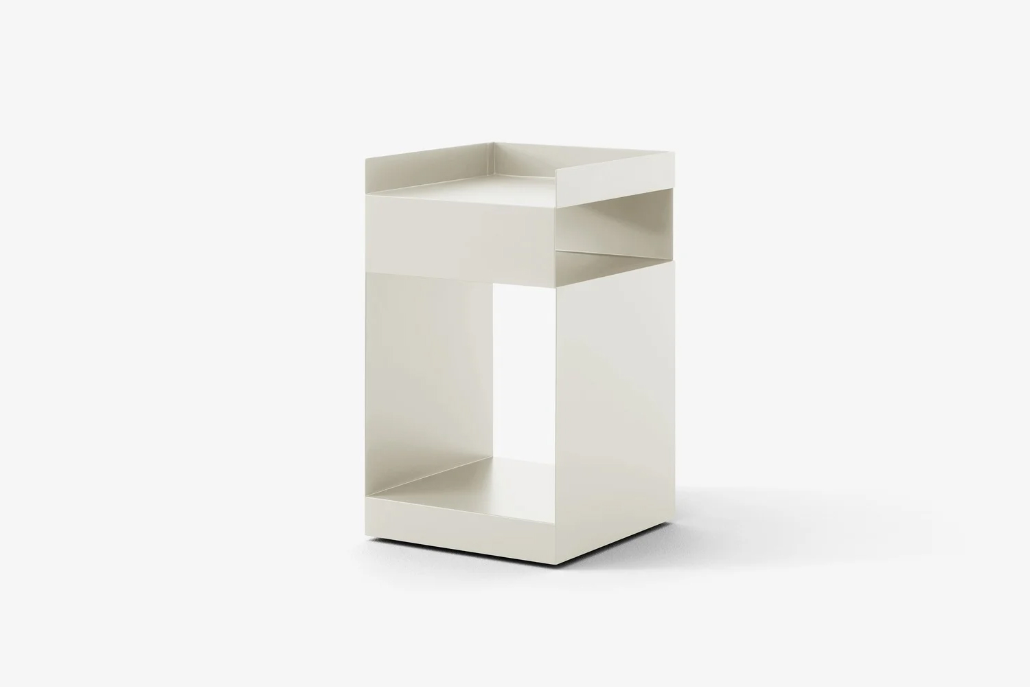 Space Copenhagen Rotate Table SC73 used as a bedside table with curated objects.