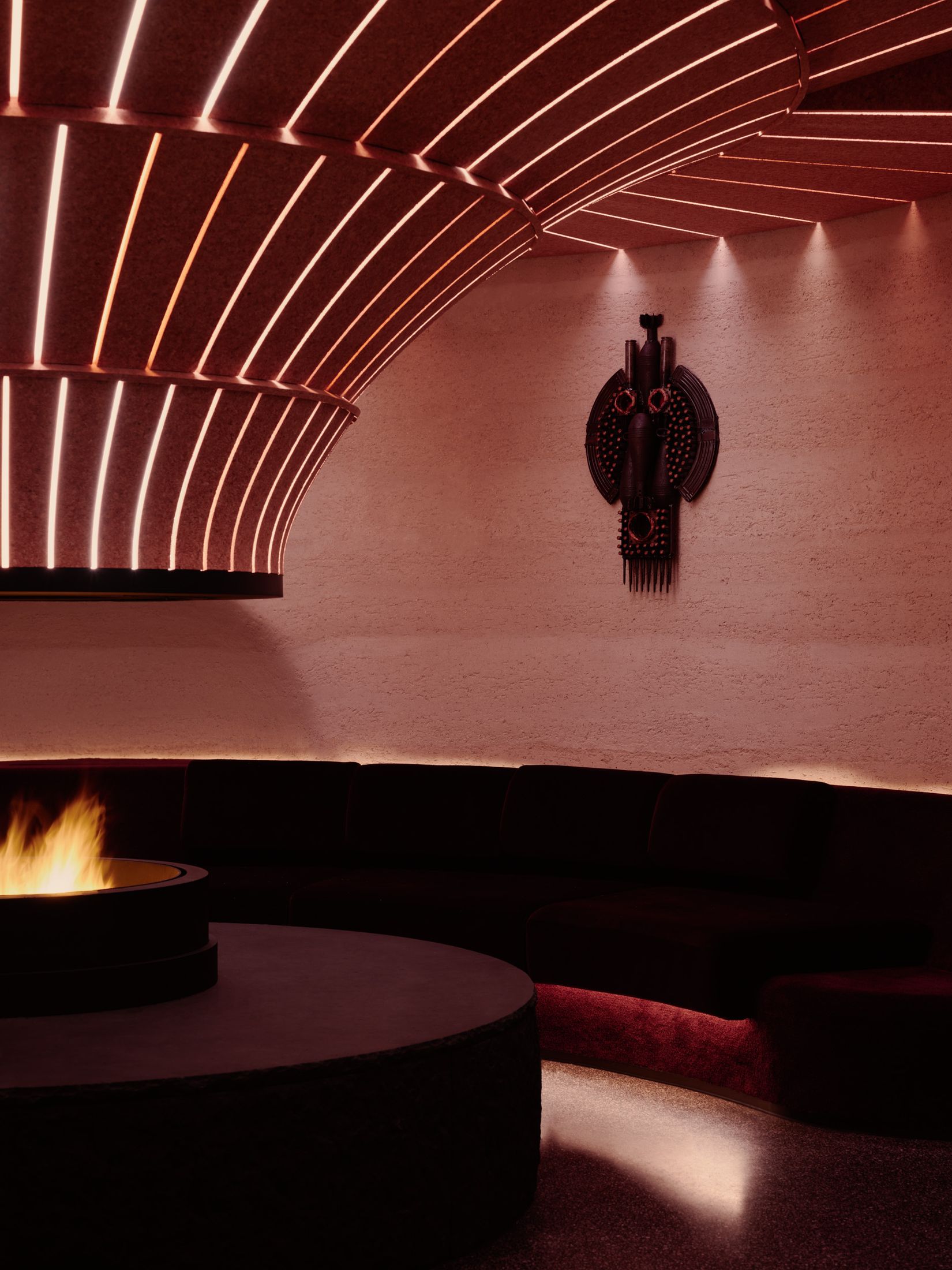 Wall murals and African-inspired art elements in the club interior.