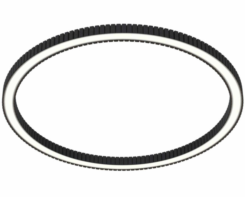 Close-up of a black circular ridged acoustic light fixture with a white inner edge.