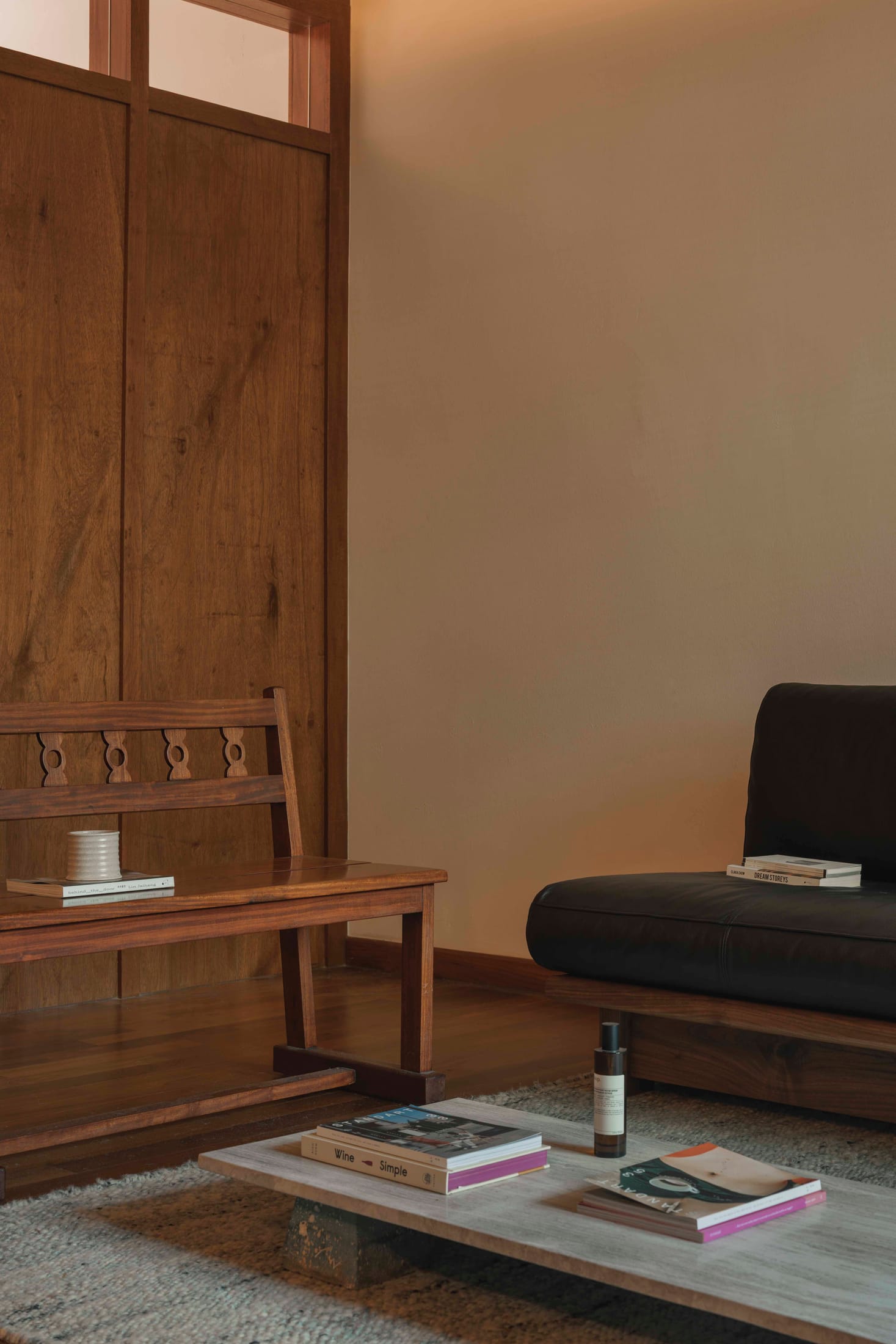 Potted plants placed near a window with soft light filtering through sheer curtains.