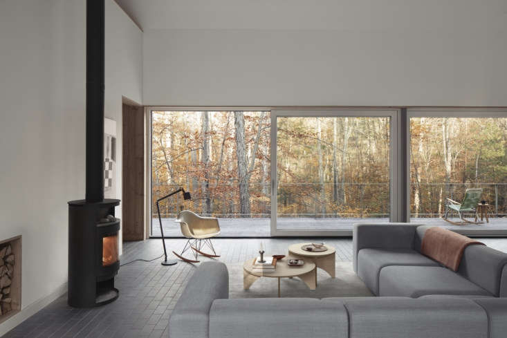 View from an indoor sofa looking out toward the minimalist exterior of a Passive House property.