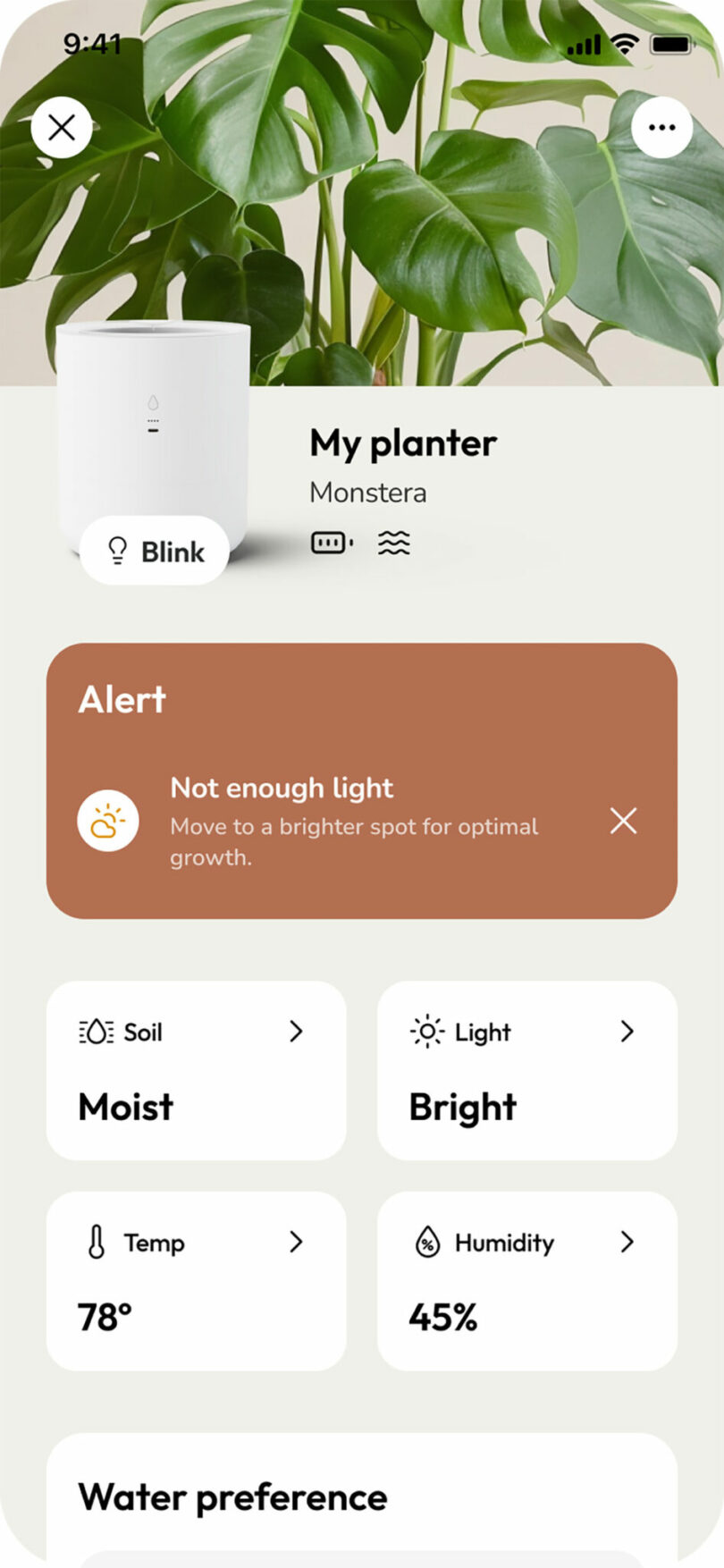 The LeafyPod app displaying a 'Not enough light' alert and specific moisture and temperature data.