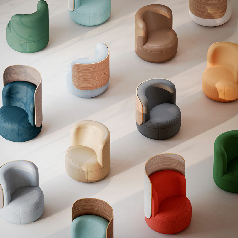 Top-down view of multiple Dotti armchairs with wooden backs arranged in rows.