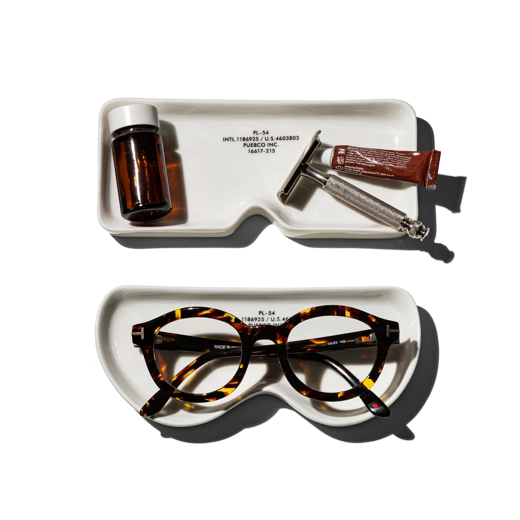 Square and Round ceramic eyeglass trays from Puebco displayed side-by-side.