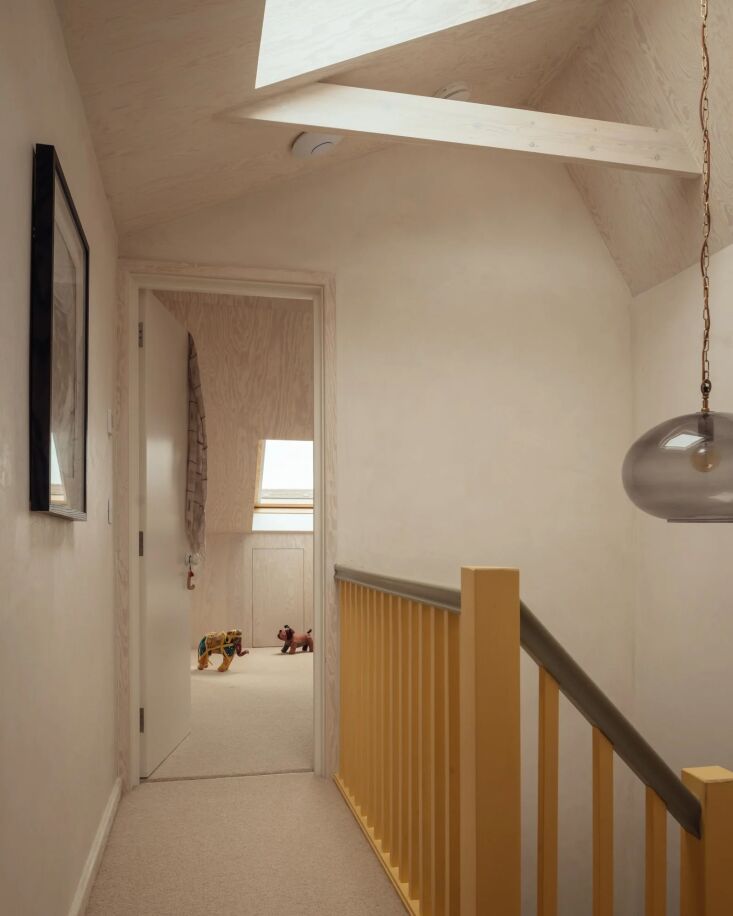 Minimalist interior corner showing smooth lime plaster finish on a wall.