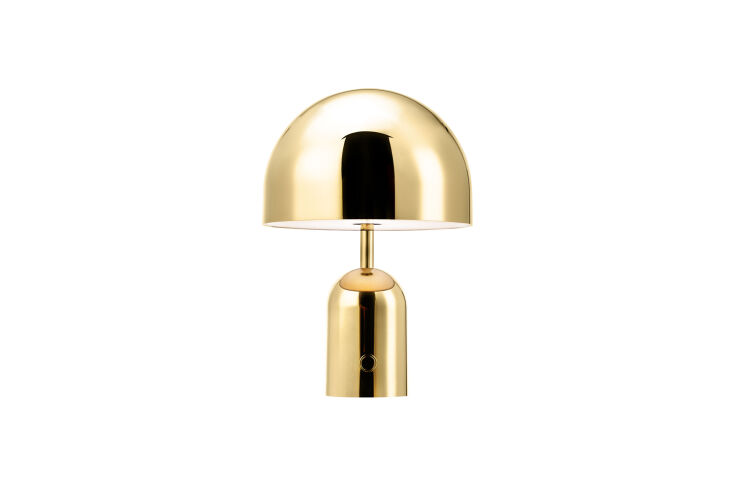 The Tom Dixon Bell Portable LED Table Lamp in a polished gold finish.