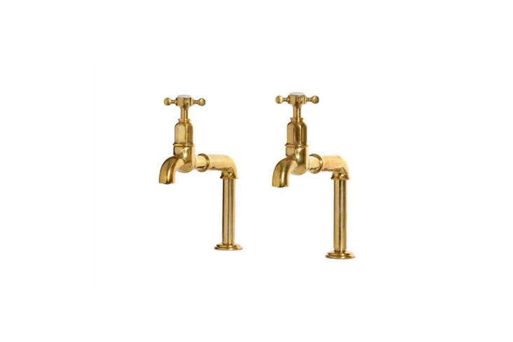 Aged brass Mayan taps installed in a vintage-style kitchen.