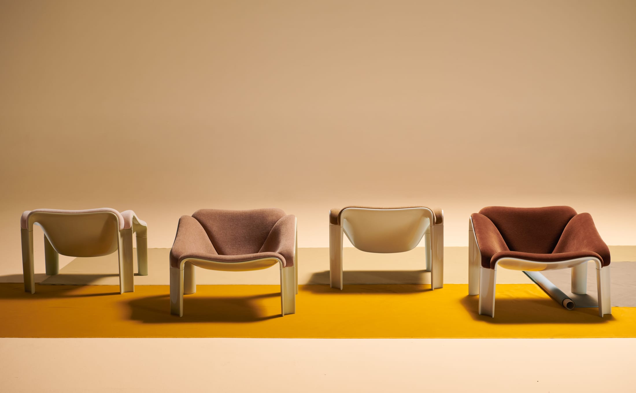Artistic campaign photo of an F300 chair in a geometric, colorful architectural setting.