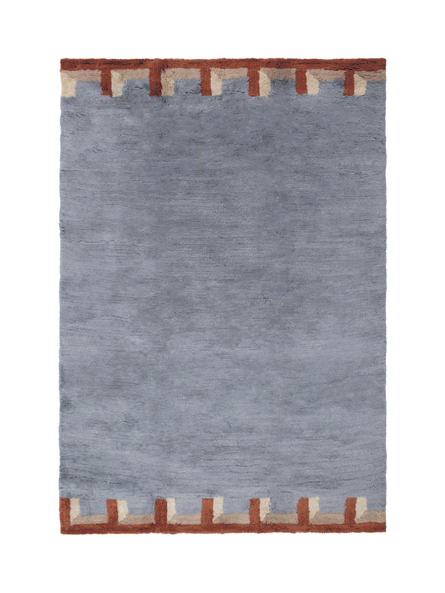 Editorial lookbook photo of the Wild South rug collection in a minimalist, naturally lit room.
