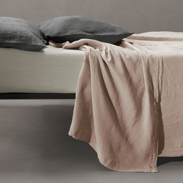 Luxury Italian froissé linen sheet with a sophisticated wrinkled texture.