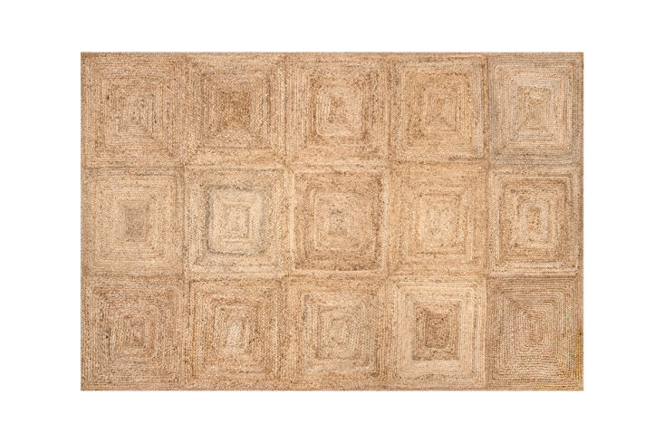 A tiled jute rug on the floor of a bedroom with blue accents.