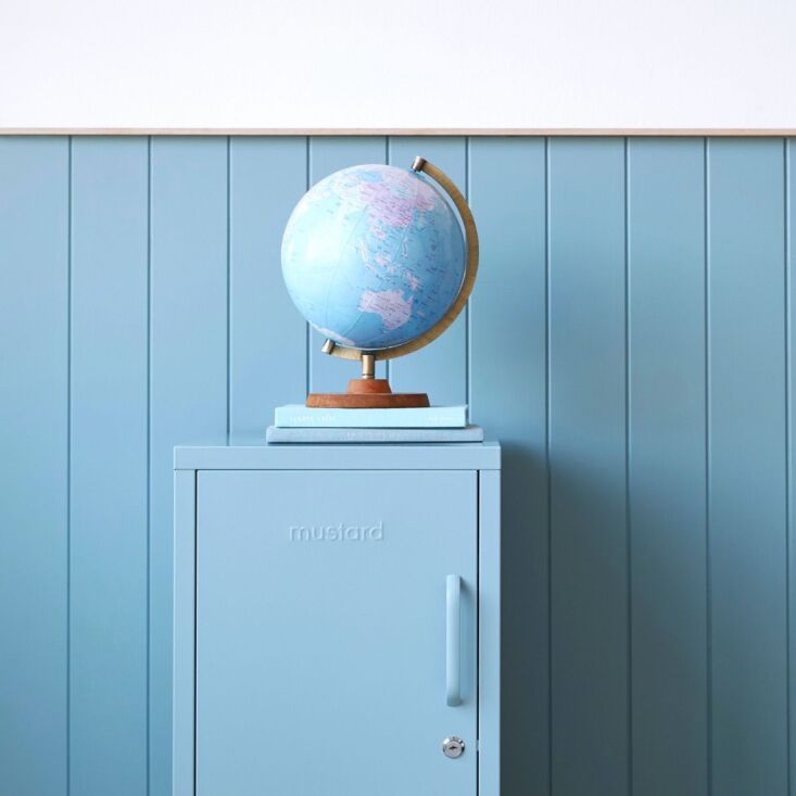 A close-up of 'The Shorty' locker in Ocean blue showing the door handle and interior shelf.