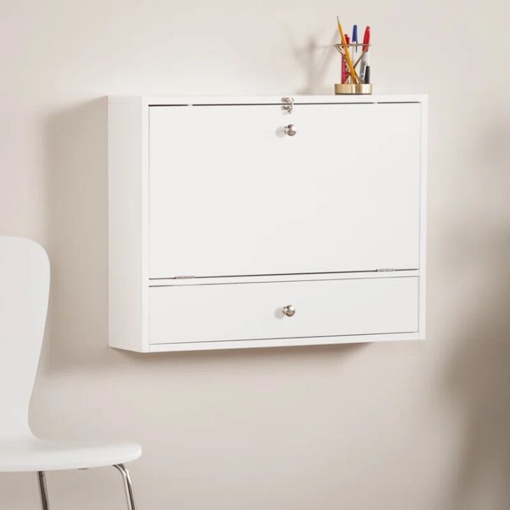 The Joachima Floating Desk mounted on a wall in its open position showing interior compartments.